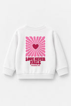 Kinder-Sweater „Love never fails (Strahlen)“ in Weiß